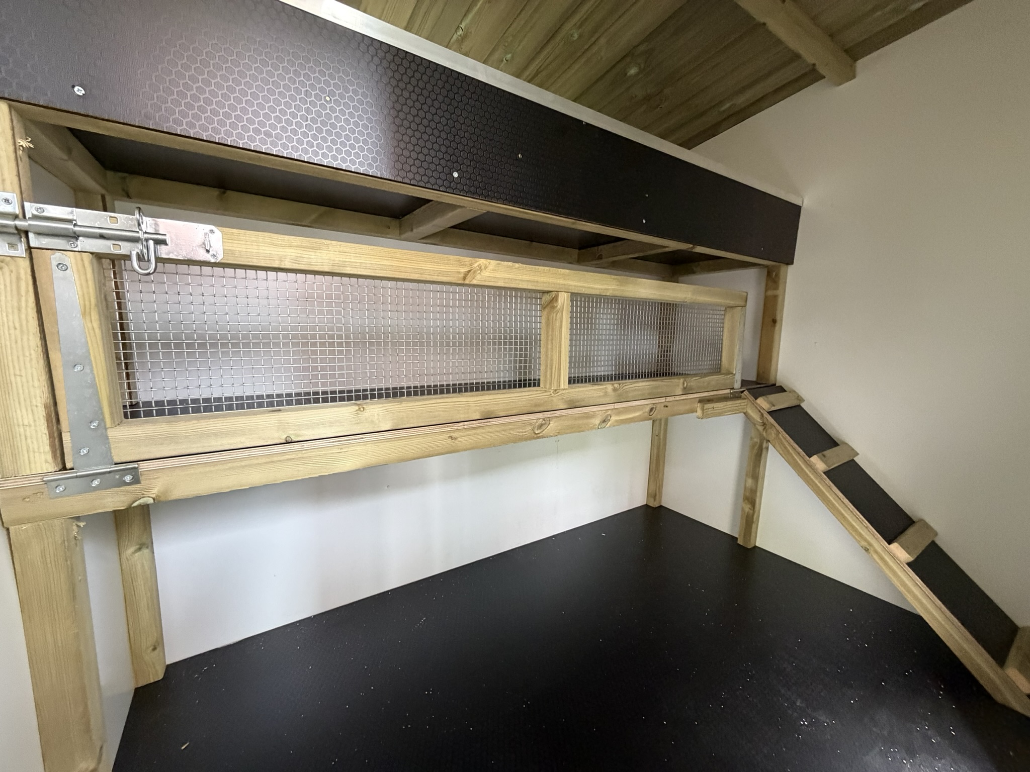 Internal housing with raised shelf and storage